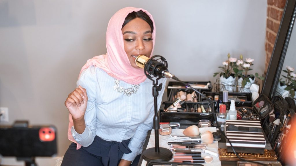 woman recording a makeup podcast