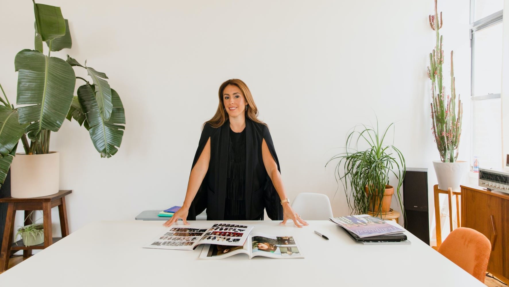 designer at the head of a boardroom table