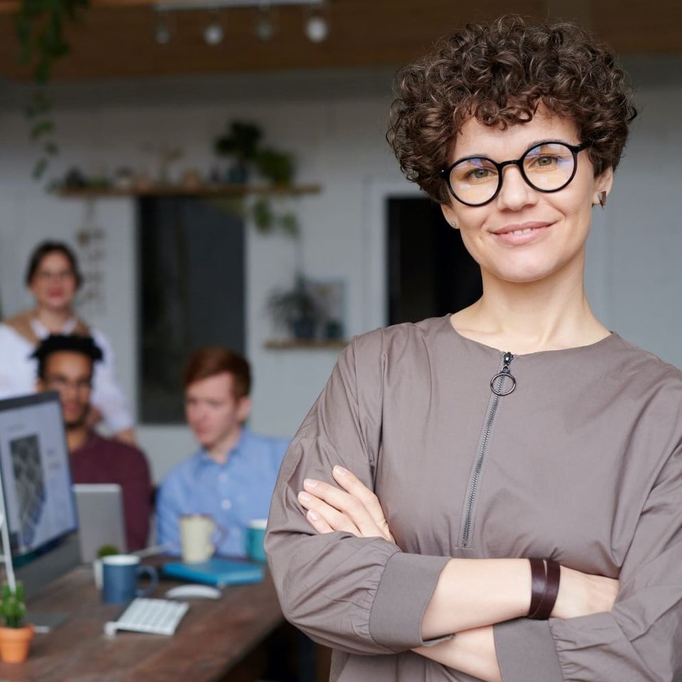 square version freelancer standing in front of her team
