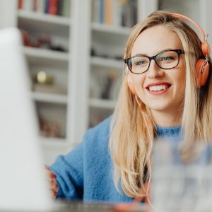 graphic designer wearing orange headphones