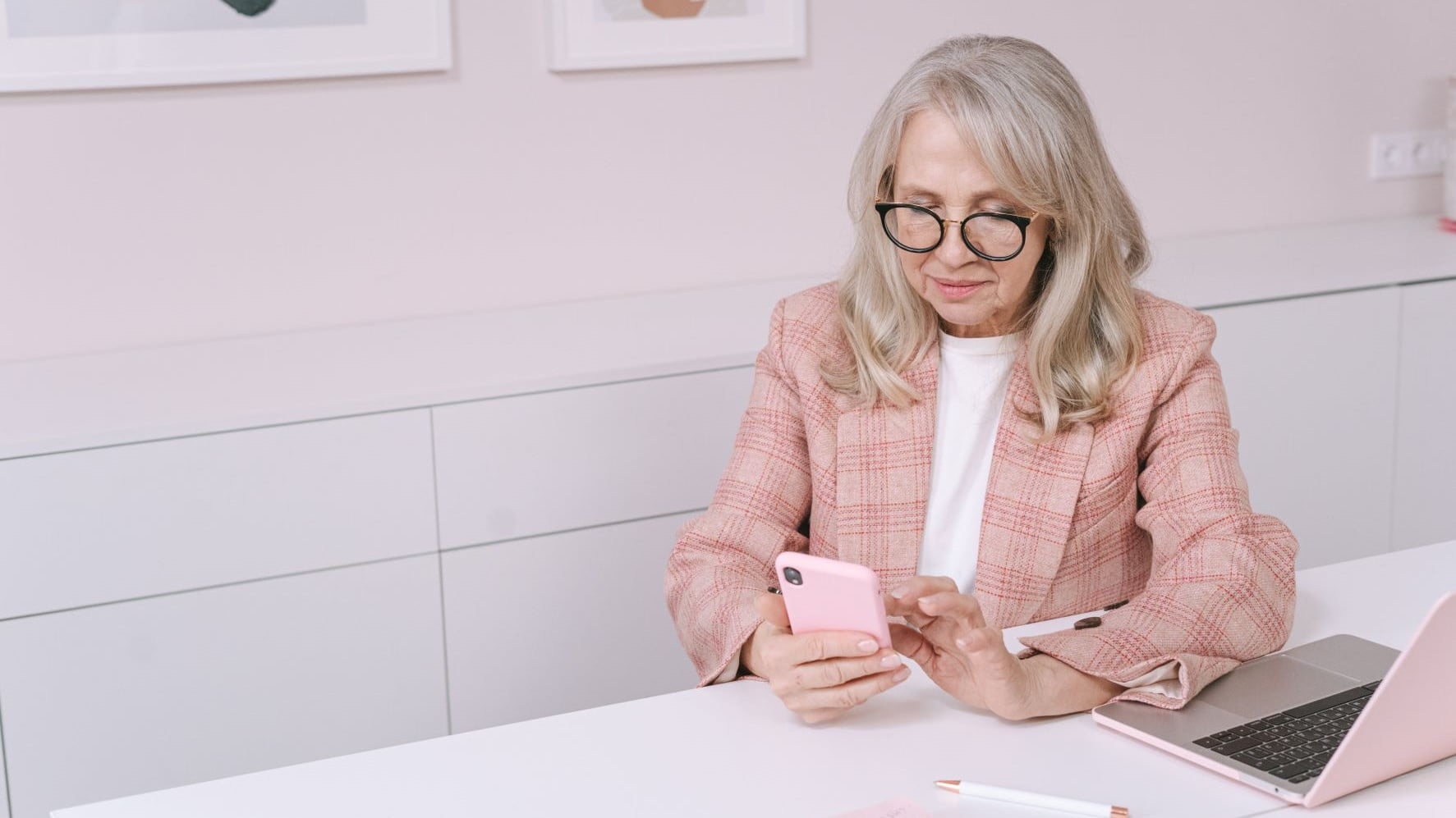 graphic design businesswoman in a pink blazer