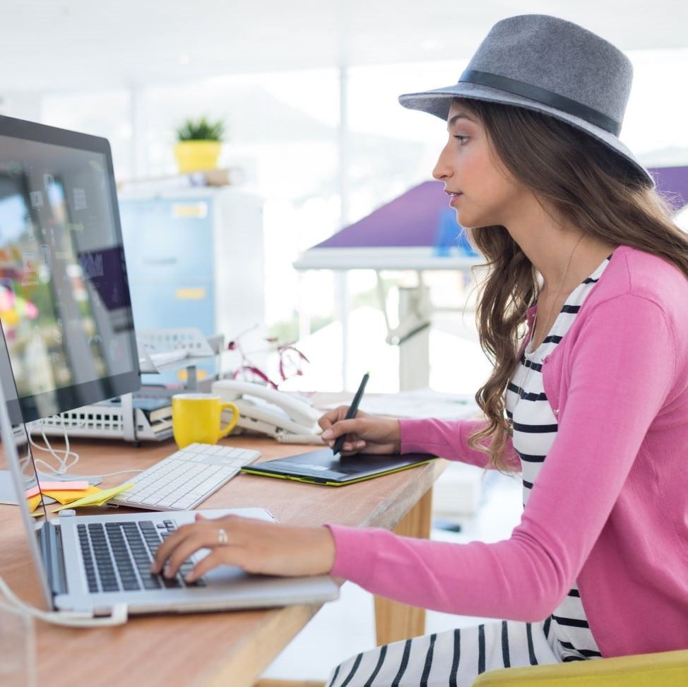 woman graphic designer sitting in a yellow chair