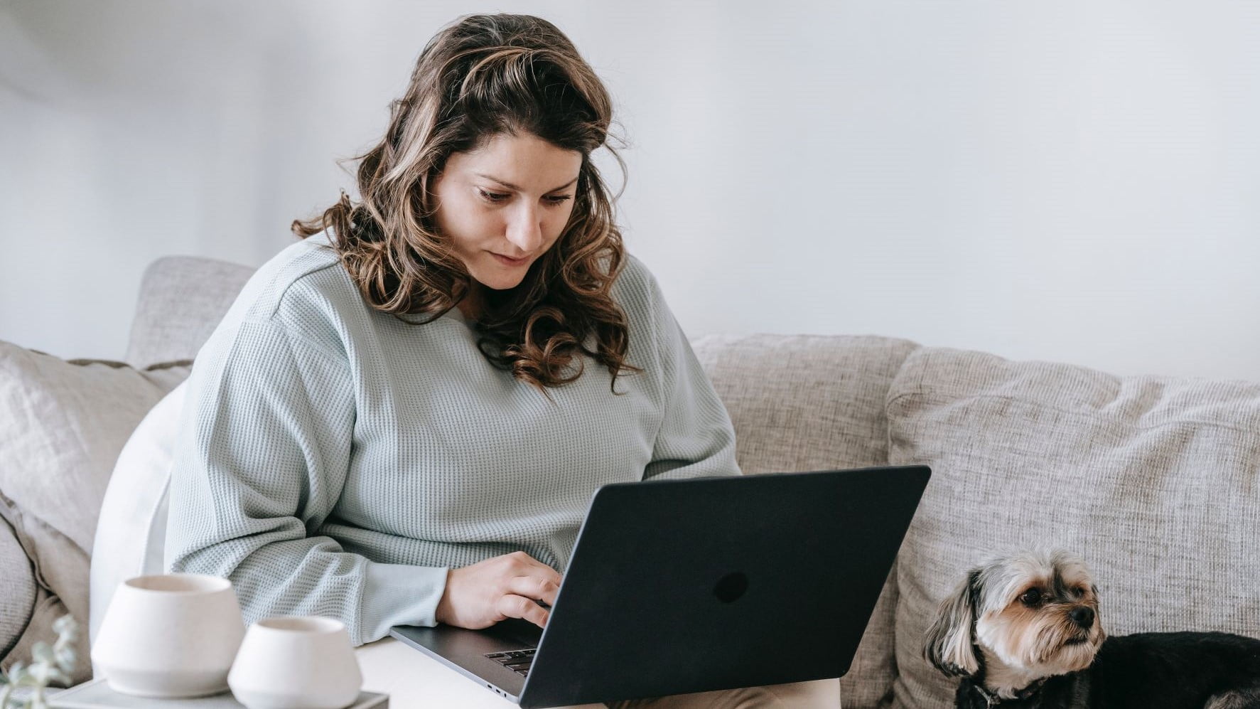 freelance brand designer working from a couch