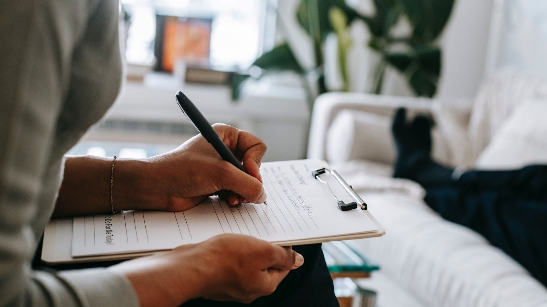 freelancer writing on a legal pad