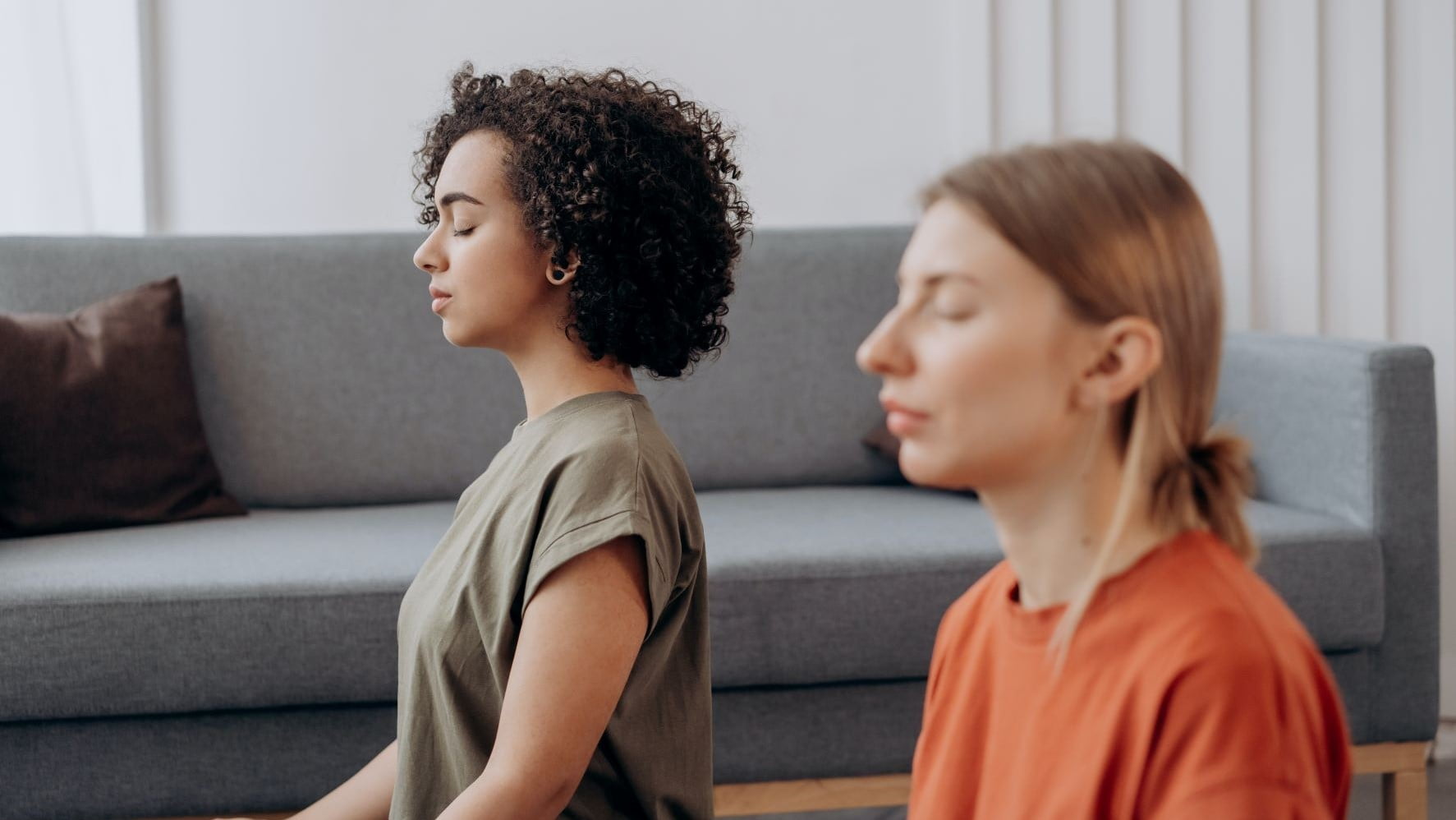 two graphic designers meditating
