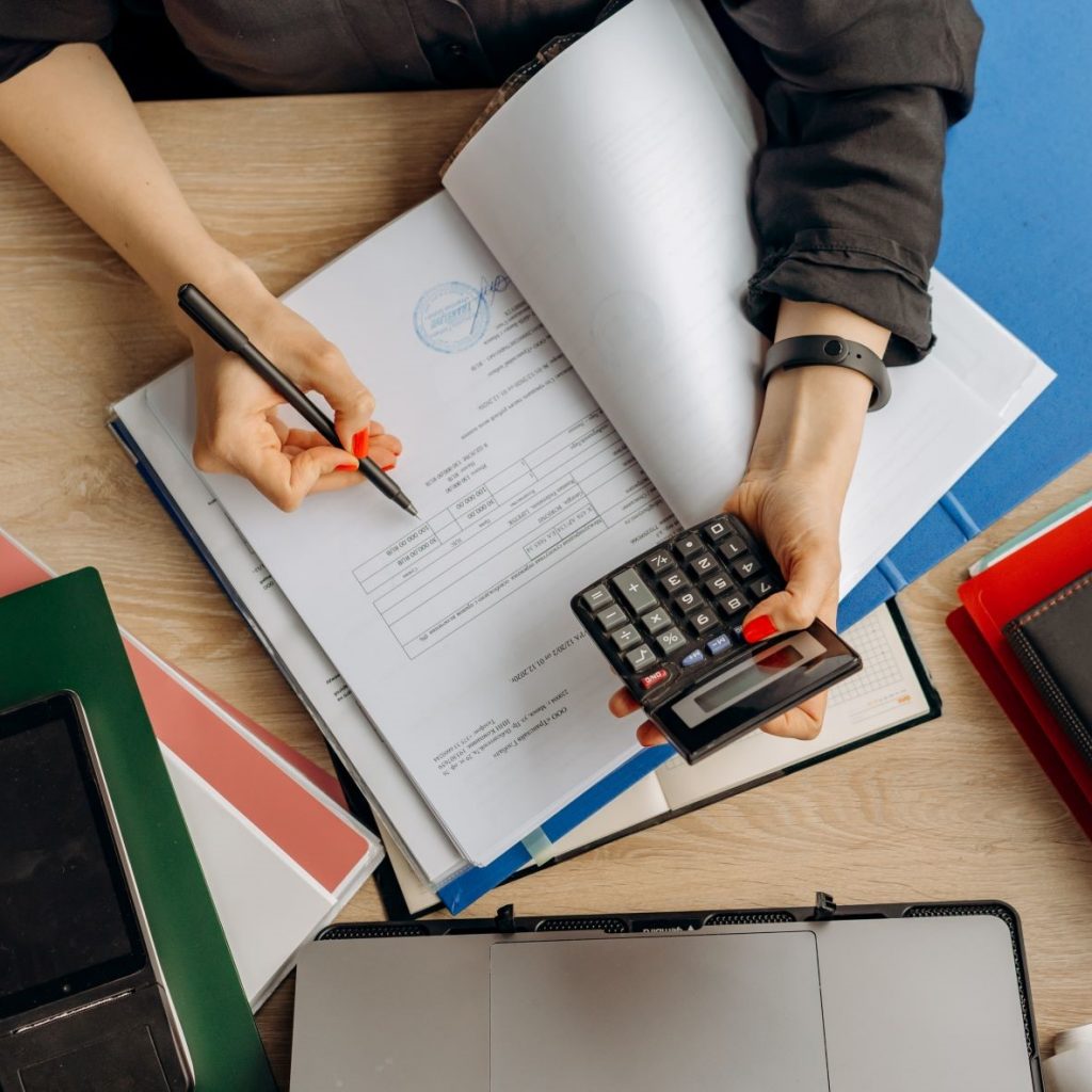 web designer holding a calculator