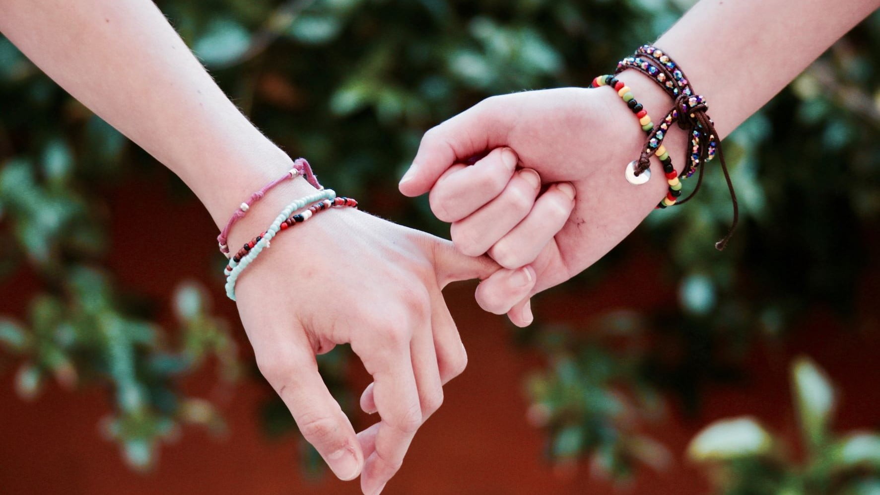 freelance brand designers giving a pinky promise