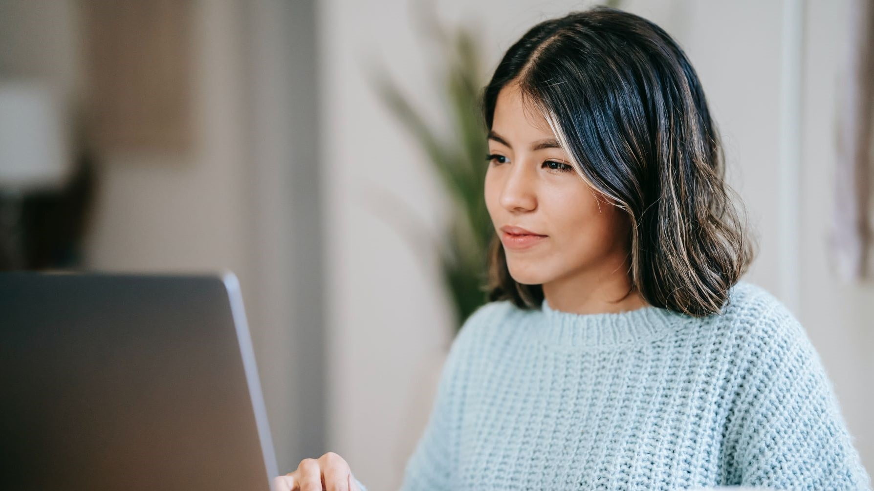 freelance graphic designer working at a laptop