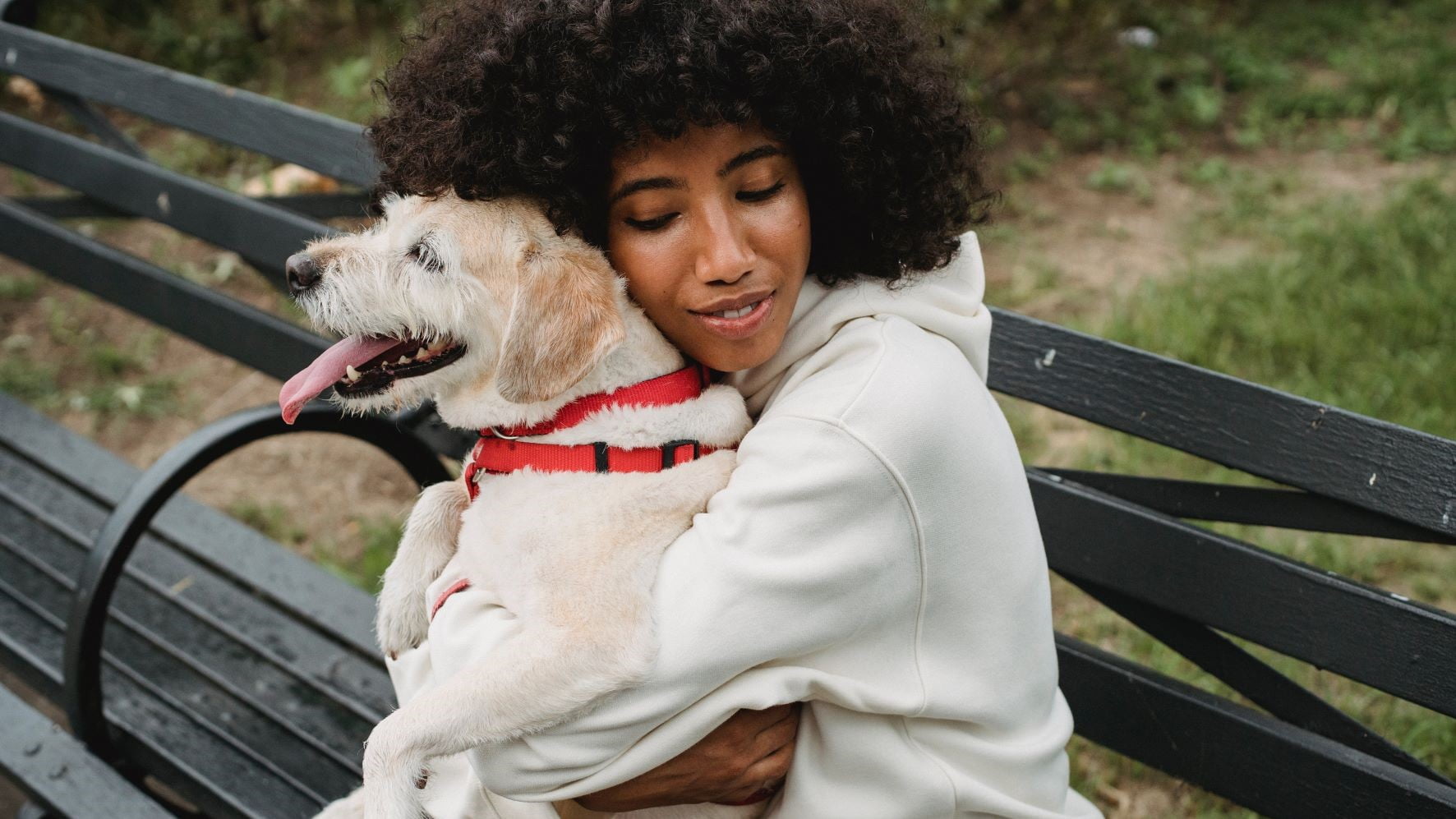 freelance graphic designer hugging her dog