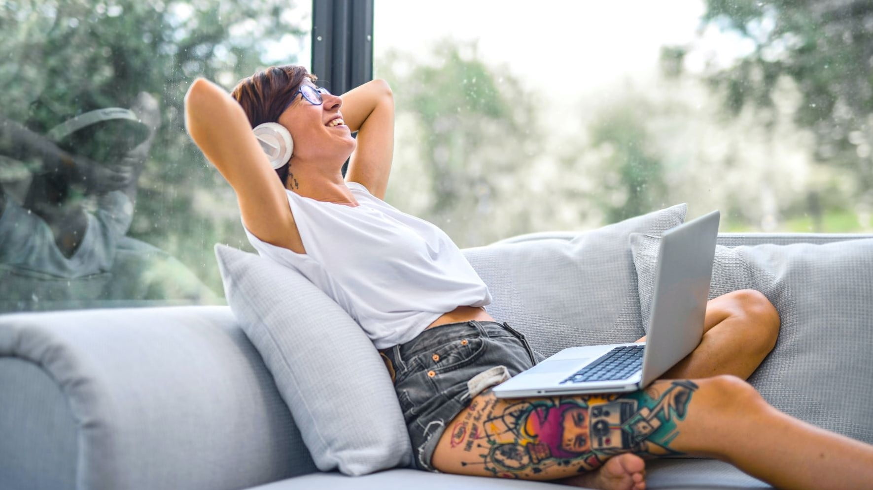 freelance web designer relaxing on a couch
